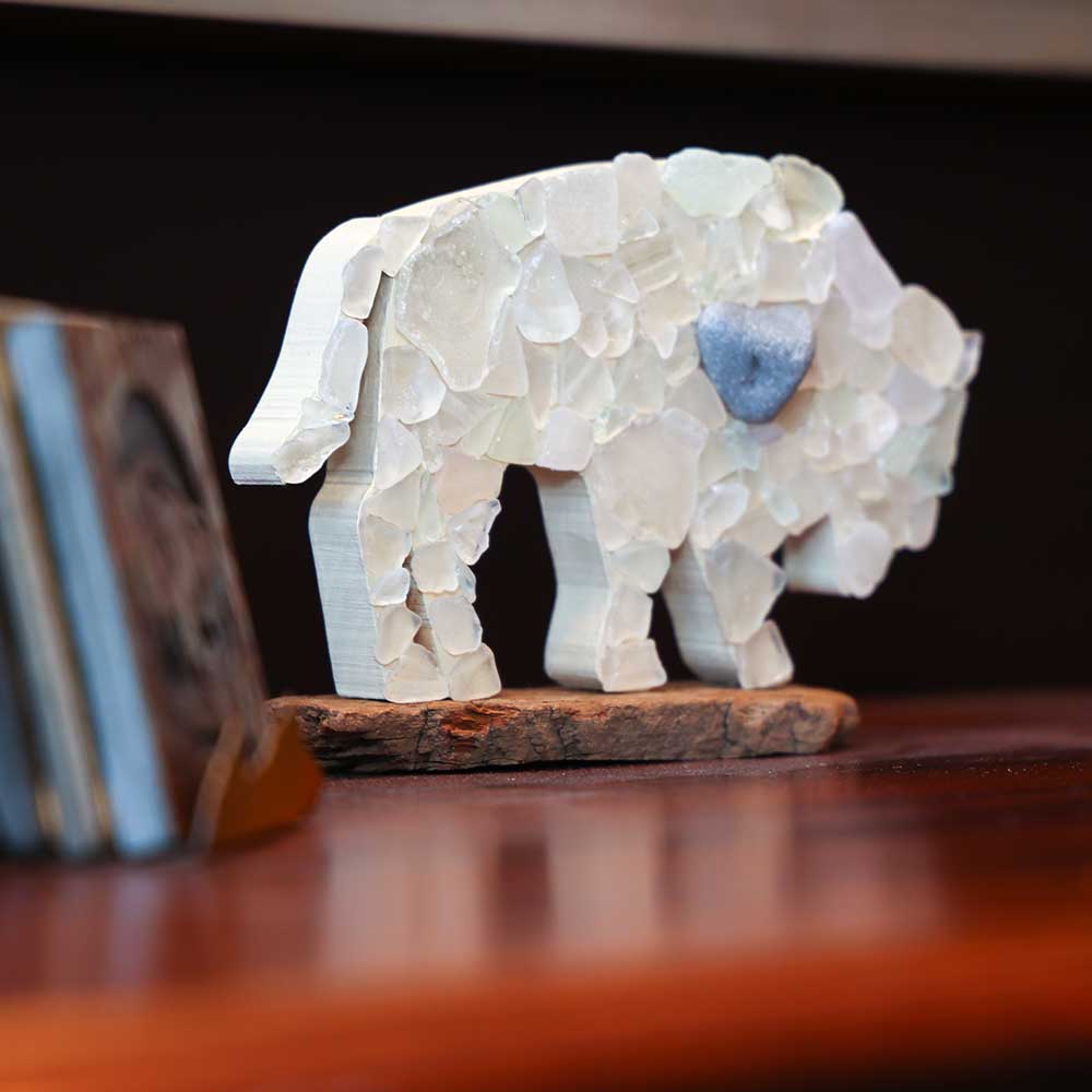 Buffalo statue on desk at Personius Melber